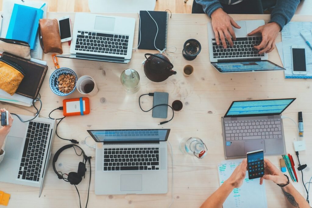 People working together with laptops and technology