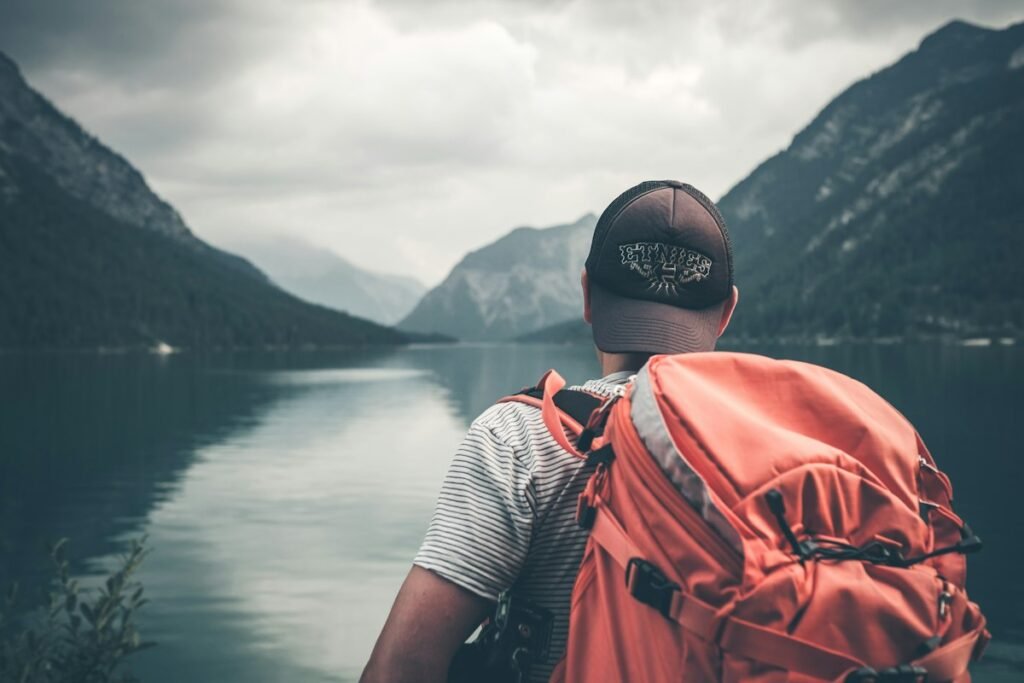 Traveller with a backpack admiring a mountain view