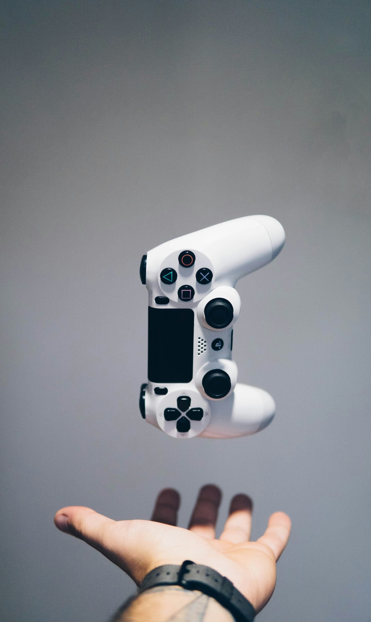 Gamer catching up on the latest video game news with a controller in hand