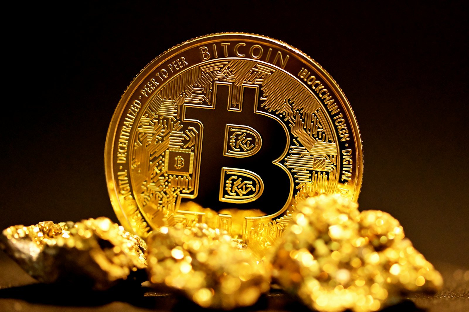 Cryptocurrency for beginners explained with physical bitcoin coins on gold nuggets